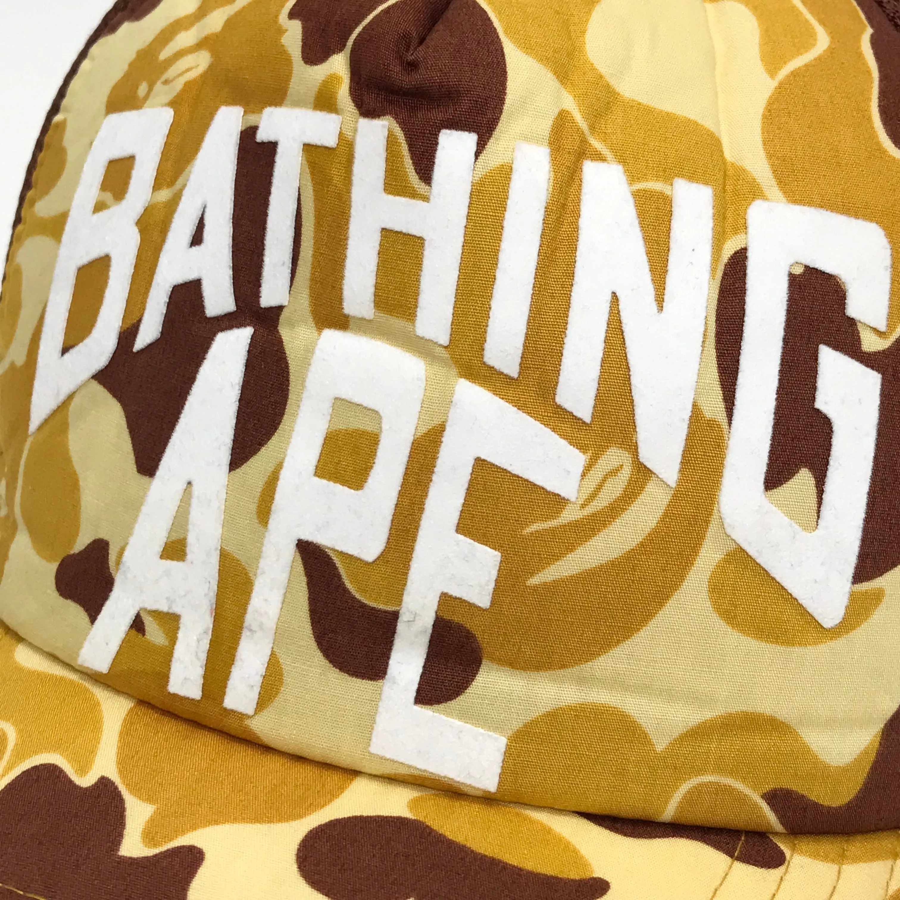 A Bathing Ape Bape Orange ABC Camo NYC Logo Mesh Trucker Cap